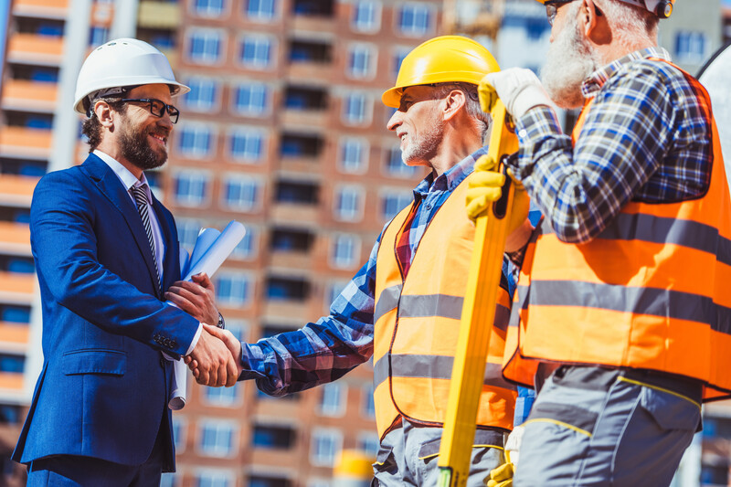 Business-Man-Construction-Man-Shaking-Hands-AdobeStock_178038879