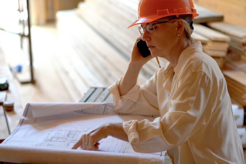 Woman-Engineer-on-Phone-on Construction-Site-AdobeStock_614754183